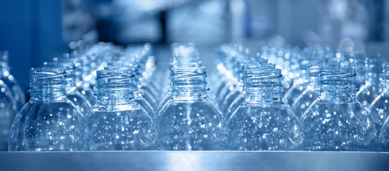 Many row of clear plastic bottles 