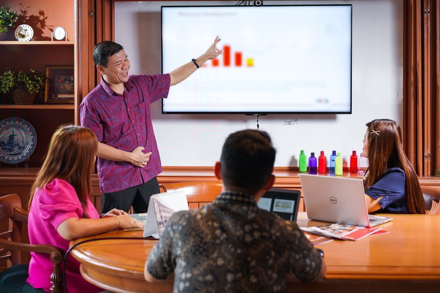 Holland Colours Asia Employees Having a Business Meeting